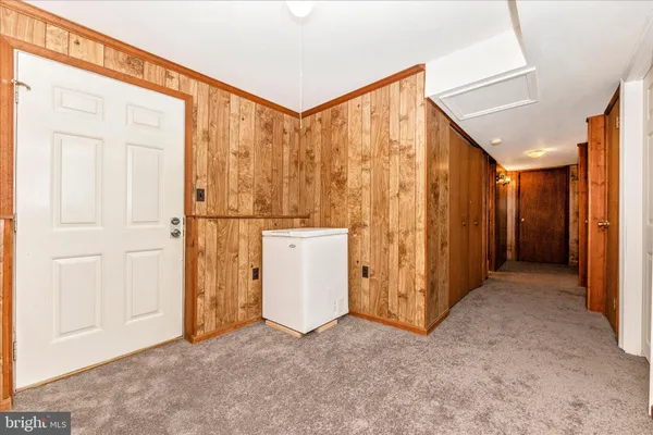 a view of a house with wooden deck
