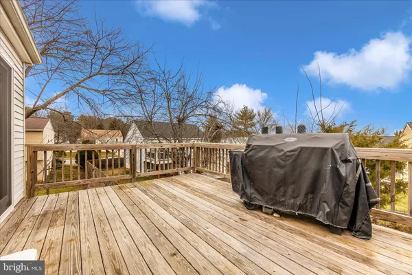 a view of a house with a yard patio and fire pit