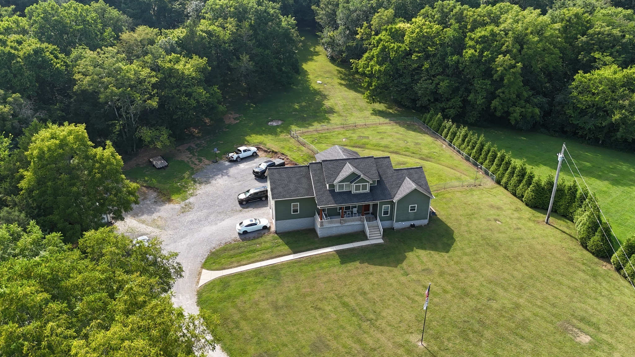 725 Lick Creek Road Hartsville, TN 37074 - Photo 6 of 71 an aerial view of a house with swimming pool and garden