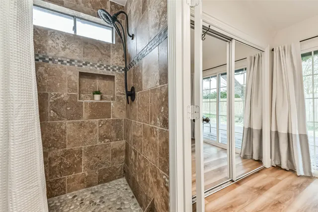 a bedroom with a bed and ceiling fan