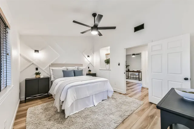 a view of room with window and ceiling fan