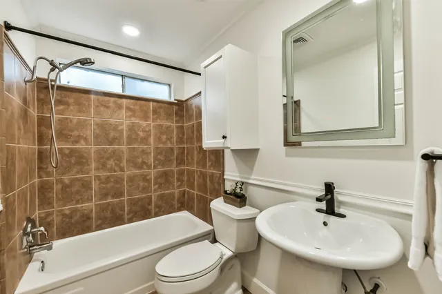 a view of a livingroom with a ceiling fan and window