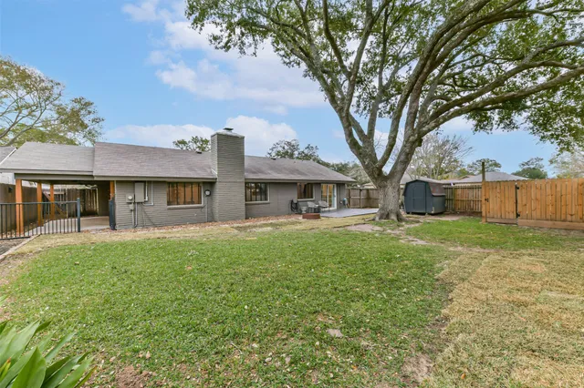 a view of a backyard with a small cabin