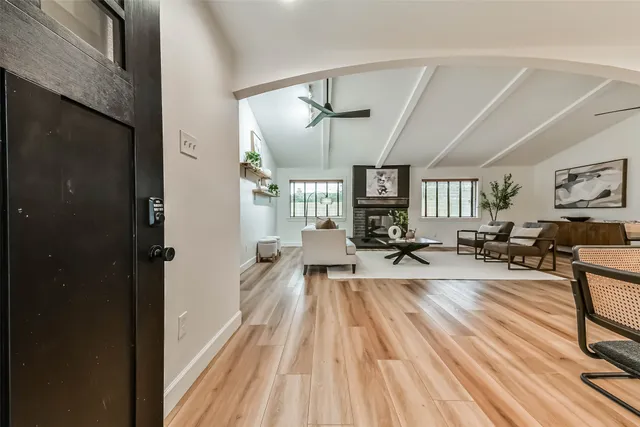a living room with furniture or couch and a wooden floor