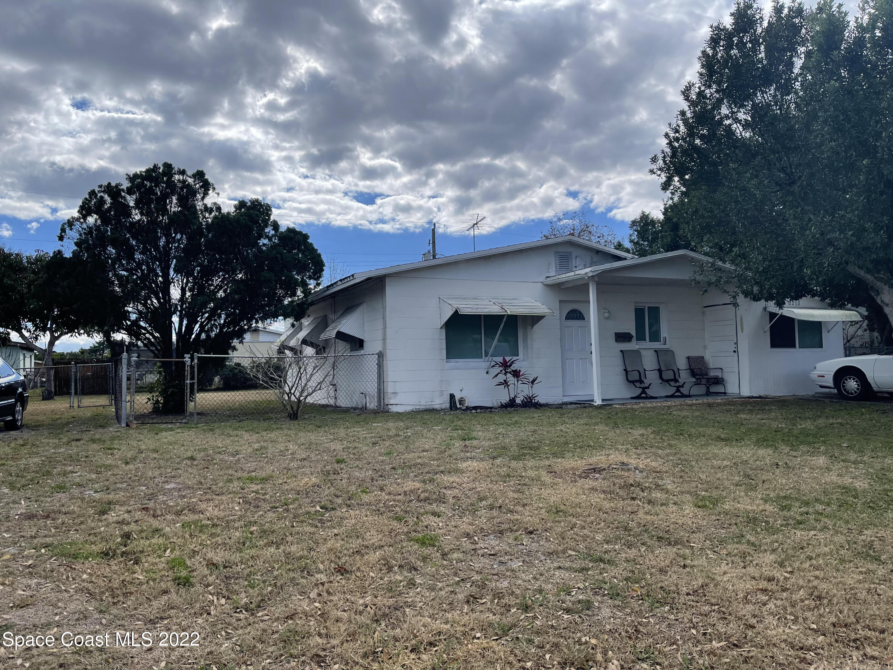 2215 King Richard Road Melbourne, FL 32935 - Photo 1 of 1 a view of a house with a backyard
