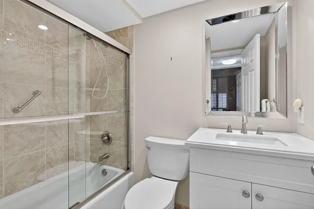 a bedroom with a bed and a shower