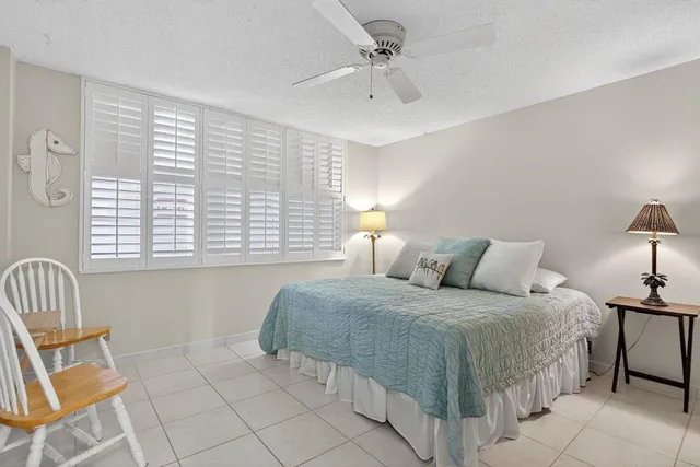 a view of a dining room with furniture and a window