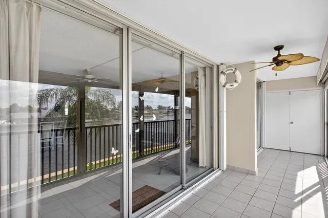 a view of a bedroom with furniture cabinet and window