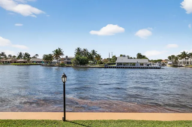 a view of a living room and entry way
