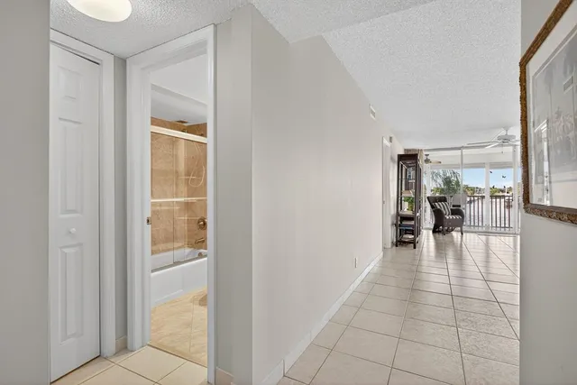 a kitchen with cabinets stainless steel appliances and a sink