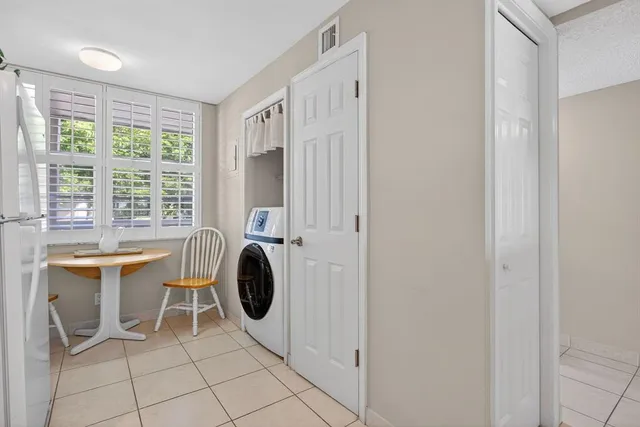 a view of a room with furniture and window