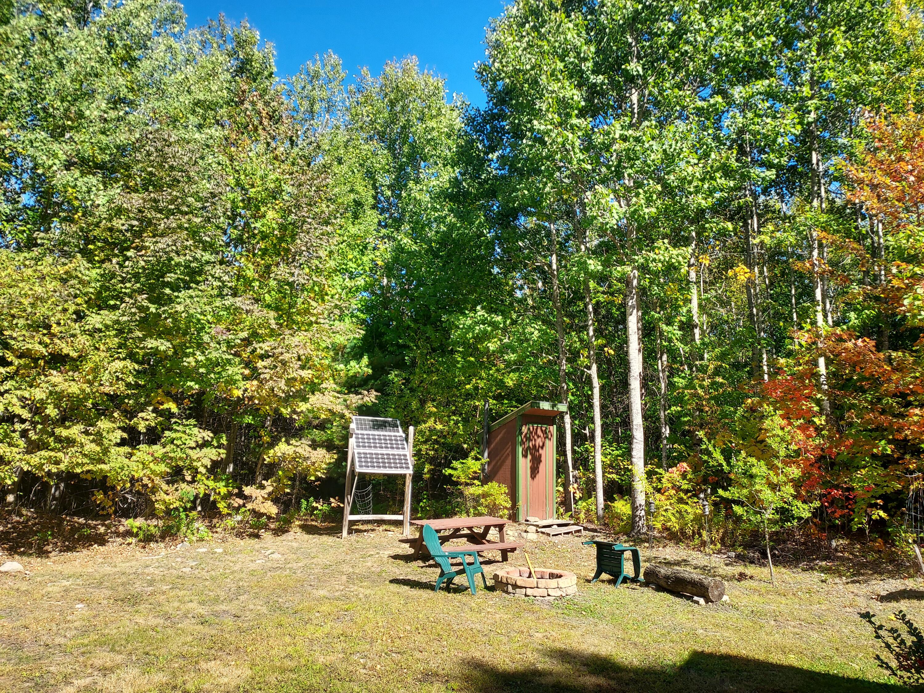 Fire Pit, Solar Panels & Privy