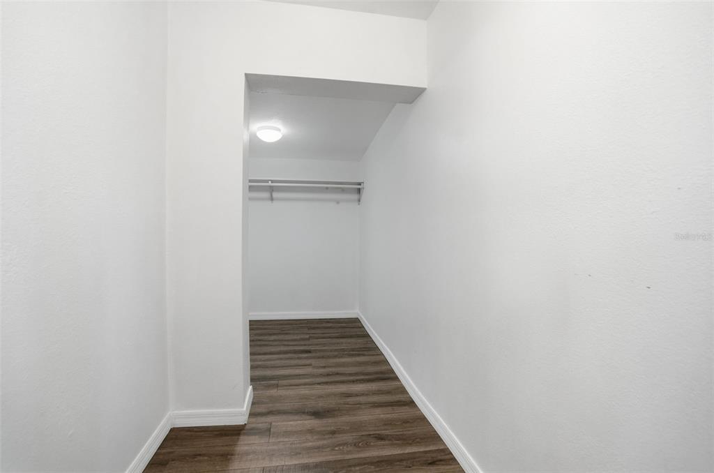 7026 Whitethorn Court Port Richey, FL 34668 - Photo 30 of 45 a view of a hallway with wooden floor