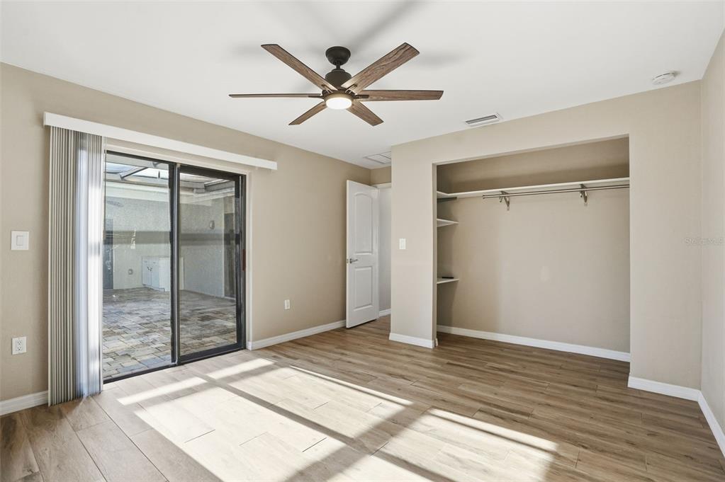 7026 Whitethorn Court Port Richey, FL 34668 - Photo 36 of 45 a view of a livingroom with a ceiling fan and wooden floor