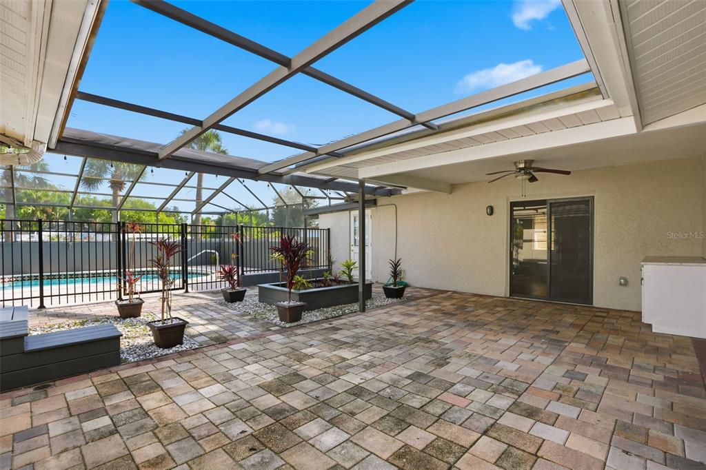 7026 Whitethorn Court Port Richey, FL 34668 - Photo 40 of 45 a view of a room with chairs in a patio