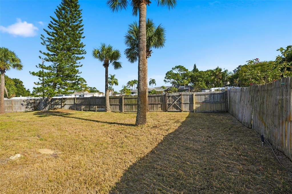 7026 Whitethorn Court Port Richey, FL 34668 - Photo 44 of 45 a view of a swimming pool with a yard