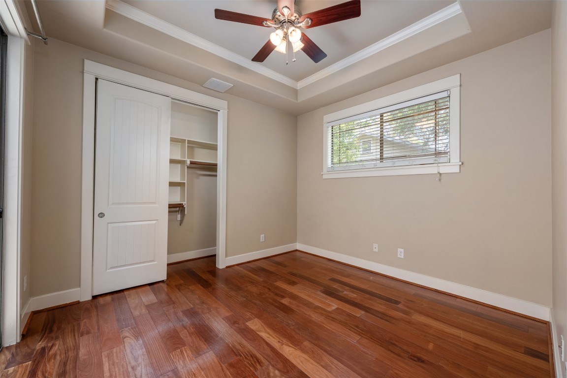 303 Zennia Street Austin, TX 78751 - Photo 18 of 40 wooden floor in an empty room with a window