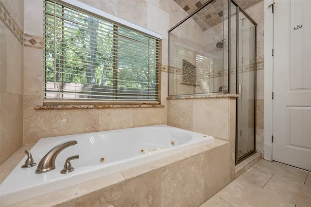 a white bath tub sitting next to a window