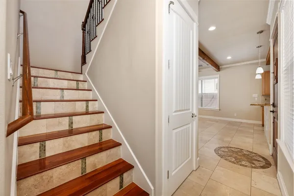 a view of entryway with wooden floor and stairs