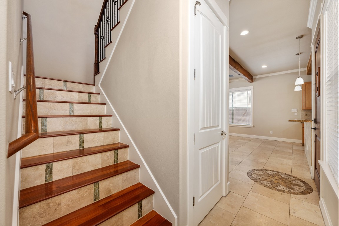 303 Zennia Street Austin, TX 78751 - Photo 24 of 40 a view of entryway with wooden floor and stairs