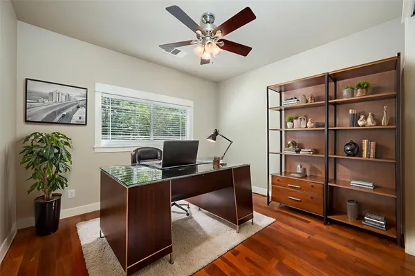 a workspace with furniture and window