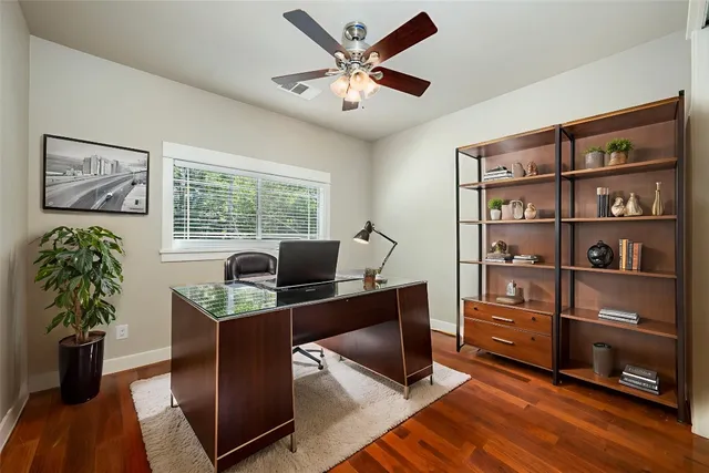 a workspace with furniture and window