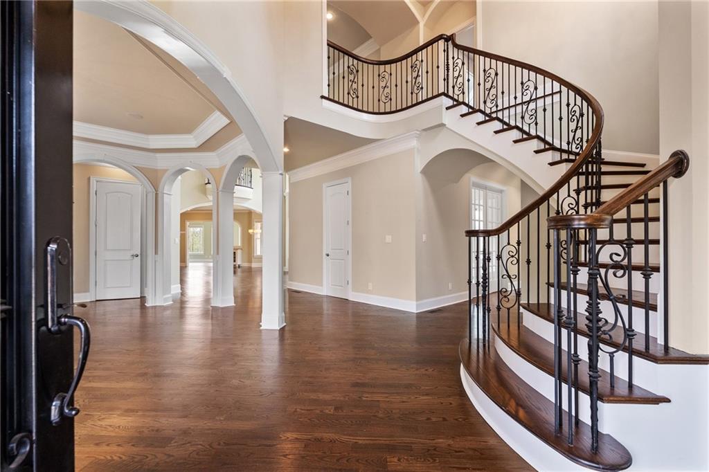 14560 Wood Road Milton, GA 30004 - Photo 7 of 74 a view of staircase with white walls and a window