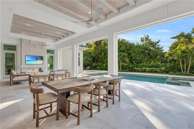 a view of a patio with a table and chairs