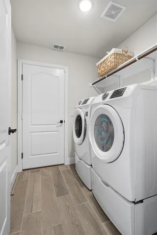 a view of a storage & utility room with washer and dryer