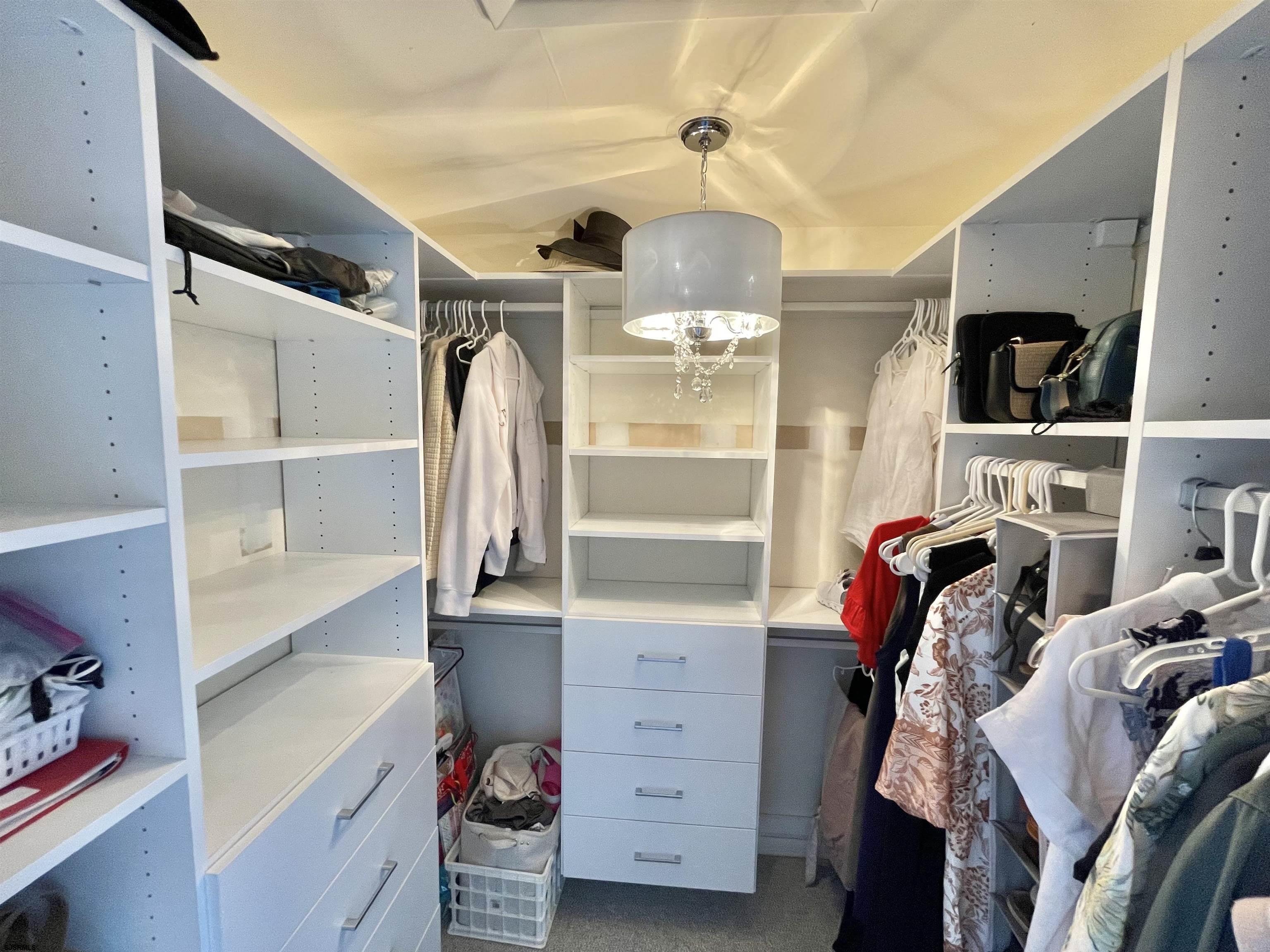 210 Harbour Cove, Unit 210 Somers Point, NJ 08244 - Photo 11 of 30 a view of walk in closet with clothes and shoes