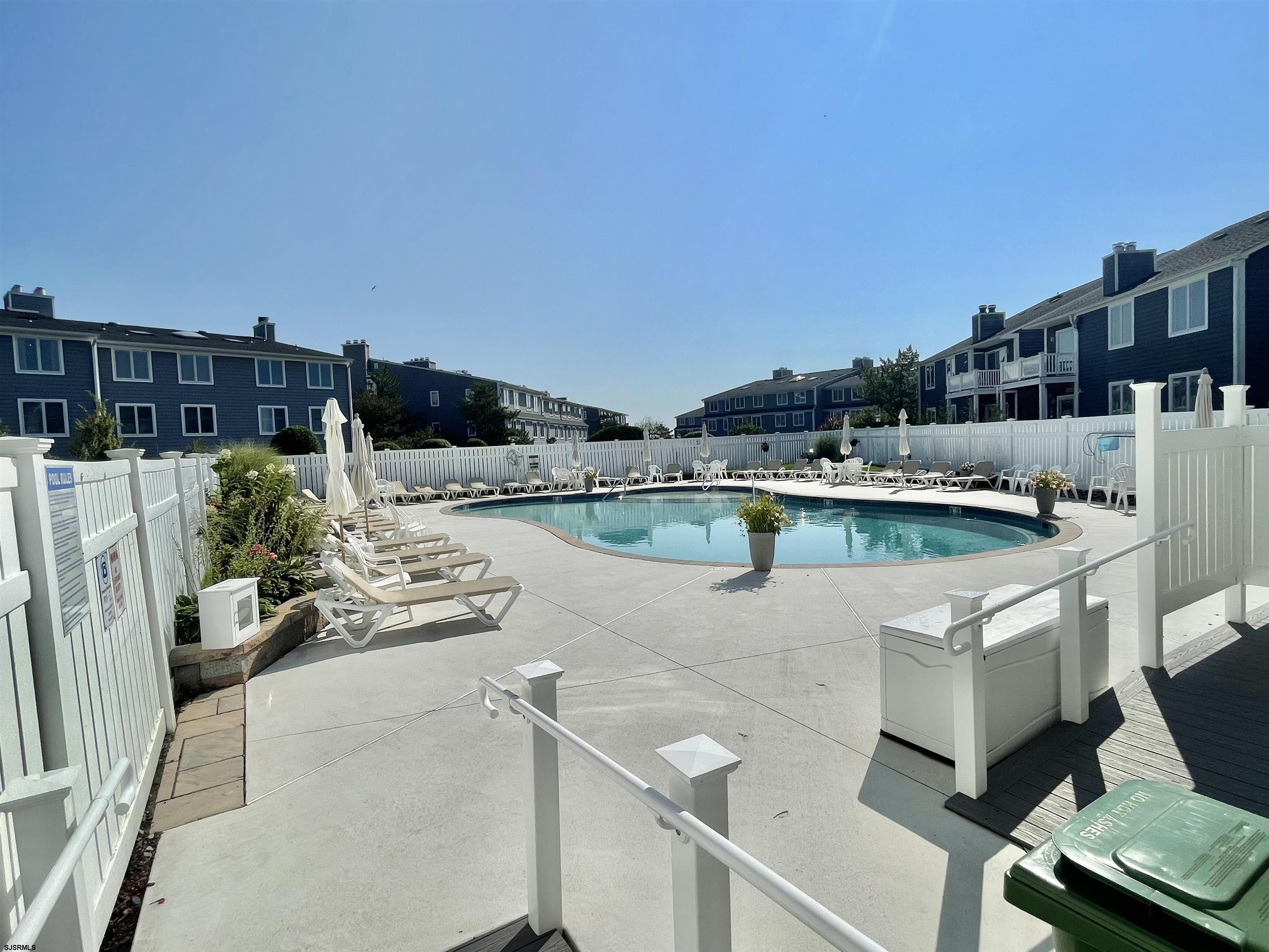 210 Harbour Cove, Unit 210 Somers Point, NJ 08244 - Photo 17 of 30 a view of a patio with couches and potted plants