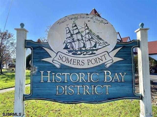 210 Harbour Cove, Unit 210 Somers Point, NJ 08244 - Photo 20 of 30 a view of a wooden house with a sign on the wall