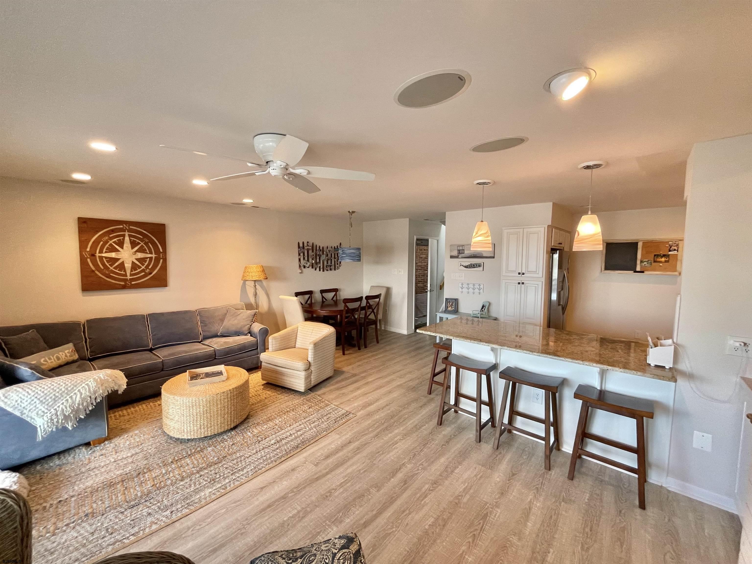 210 Harbour Cove, Unit 210 Somers Point, NJ 08244 - Photo 2 of 30 a living room with furniture and a wooden floor