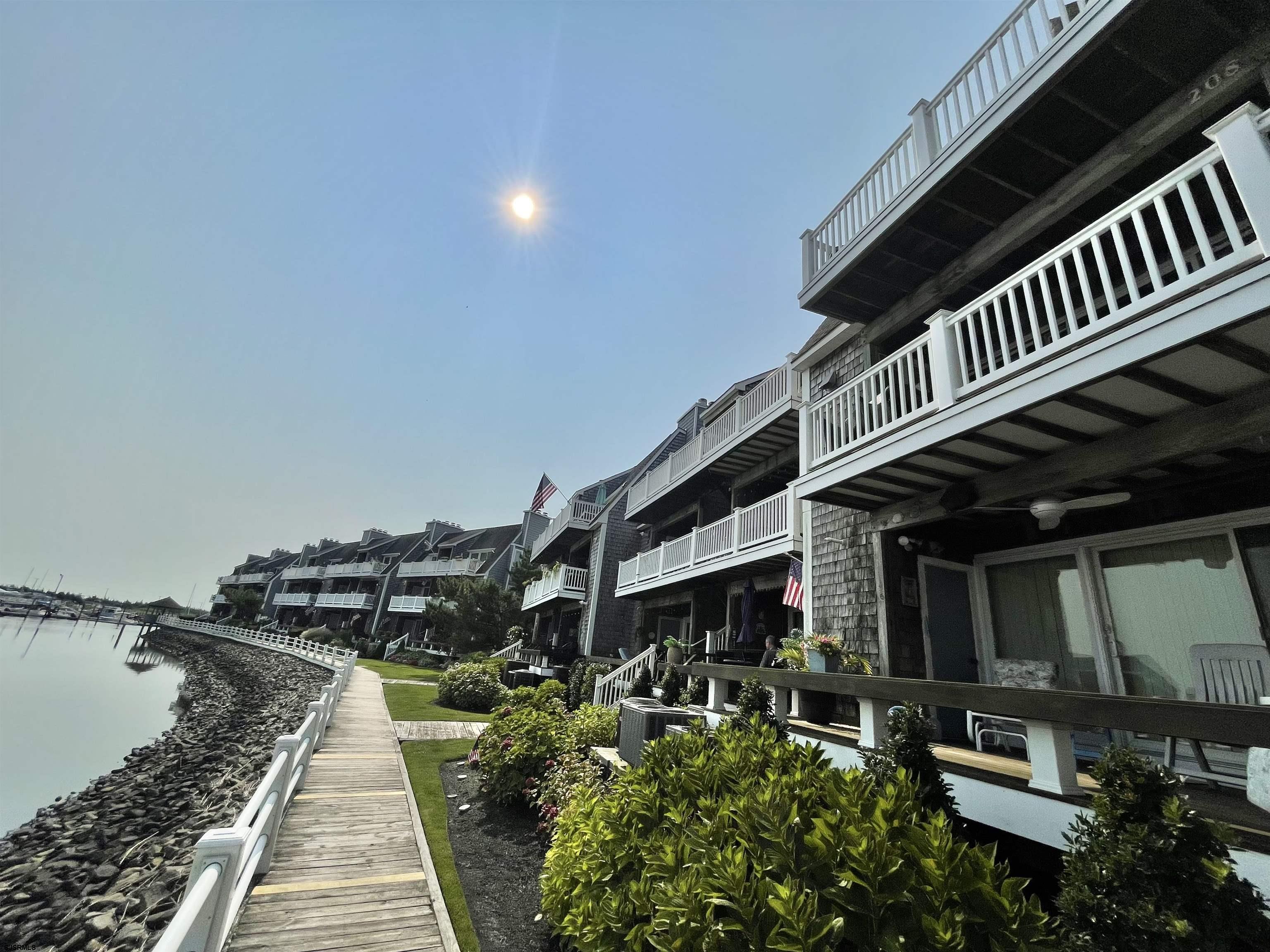 210 Harbour Cove, Unit 210 Somers Point, NJ 08244 - Photo 27 of 30 a view of a house with a deck