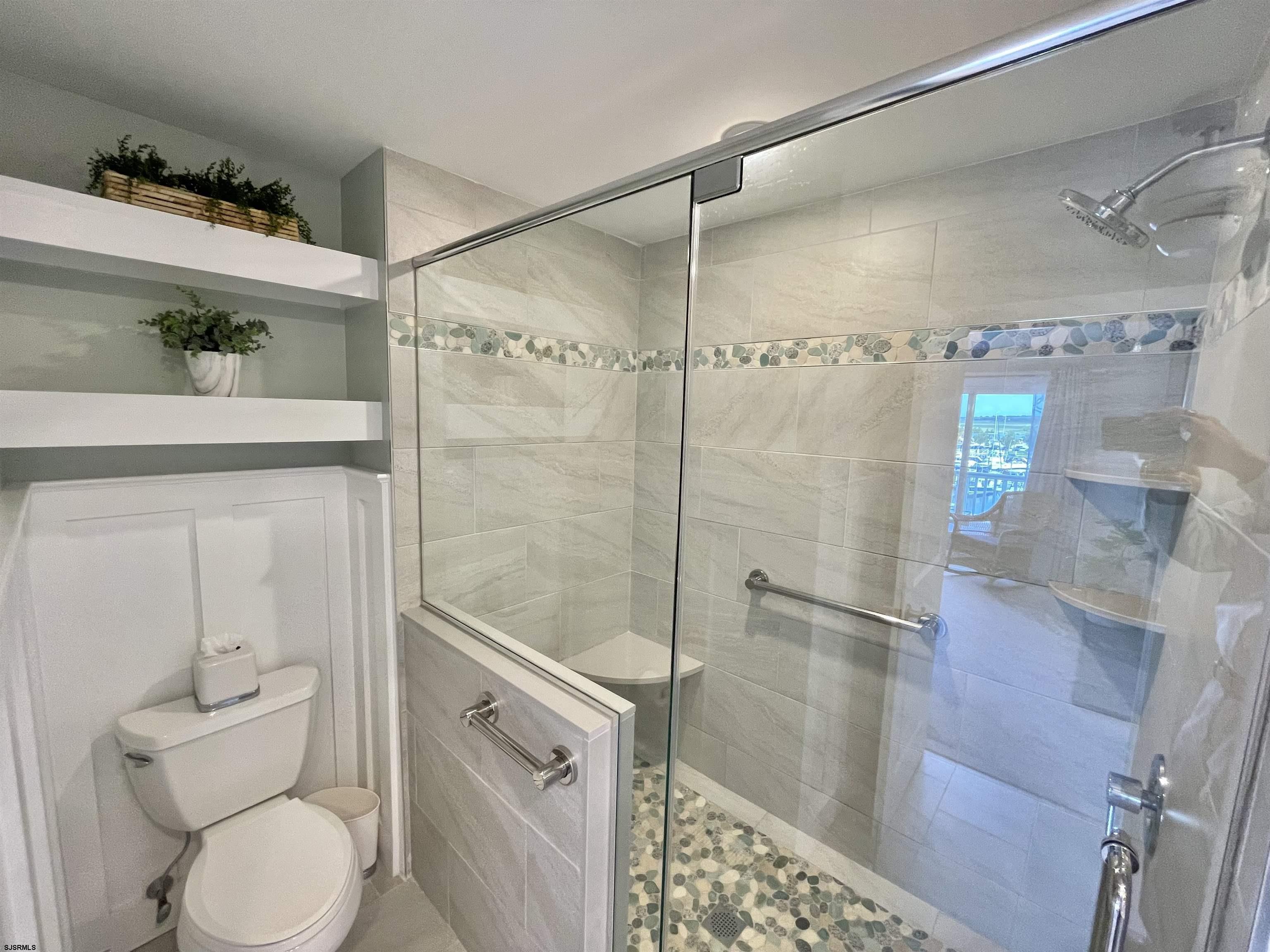 210 Harbour Cove, Unit 210 Somers Point, NJ 08244 - Photo 9 of 30 a bathroom with a shower and toilet
