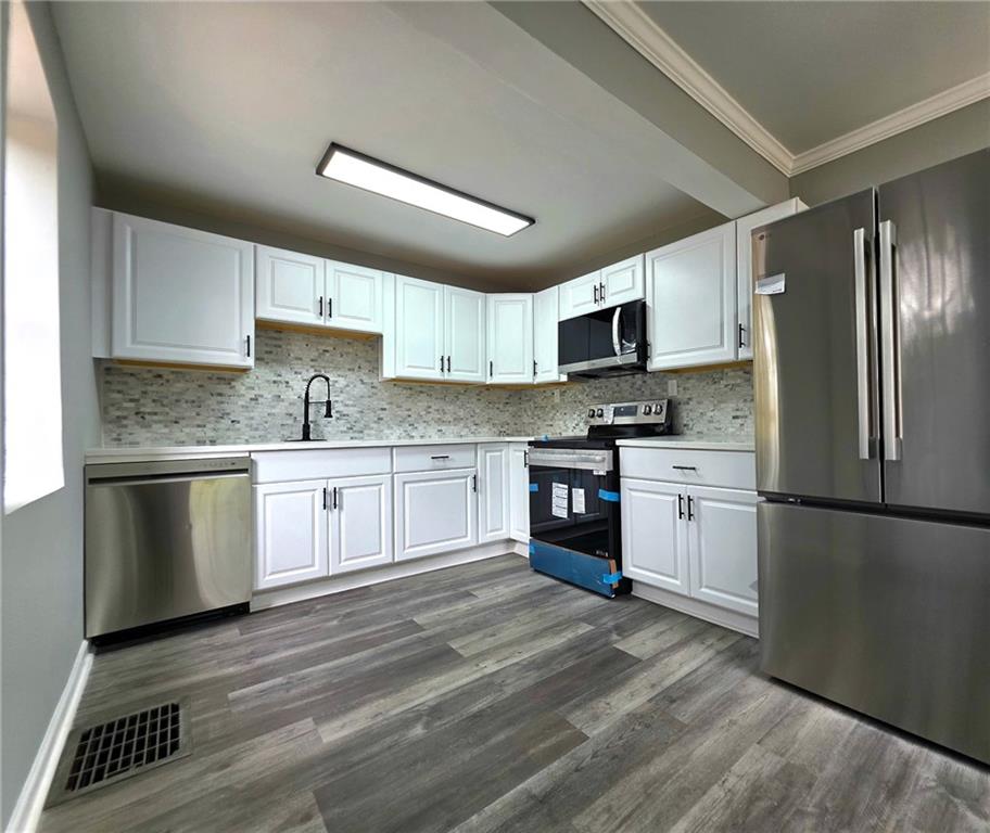 3581 Midway Road Decatur, GA 30032 - Photo 12 of 29 a kitchen with a refrigerator stove top oven and sink