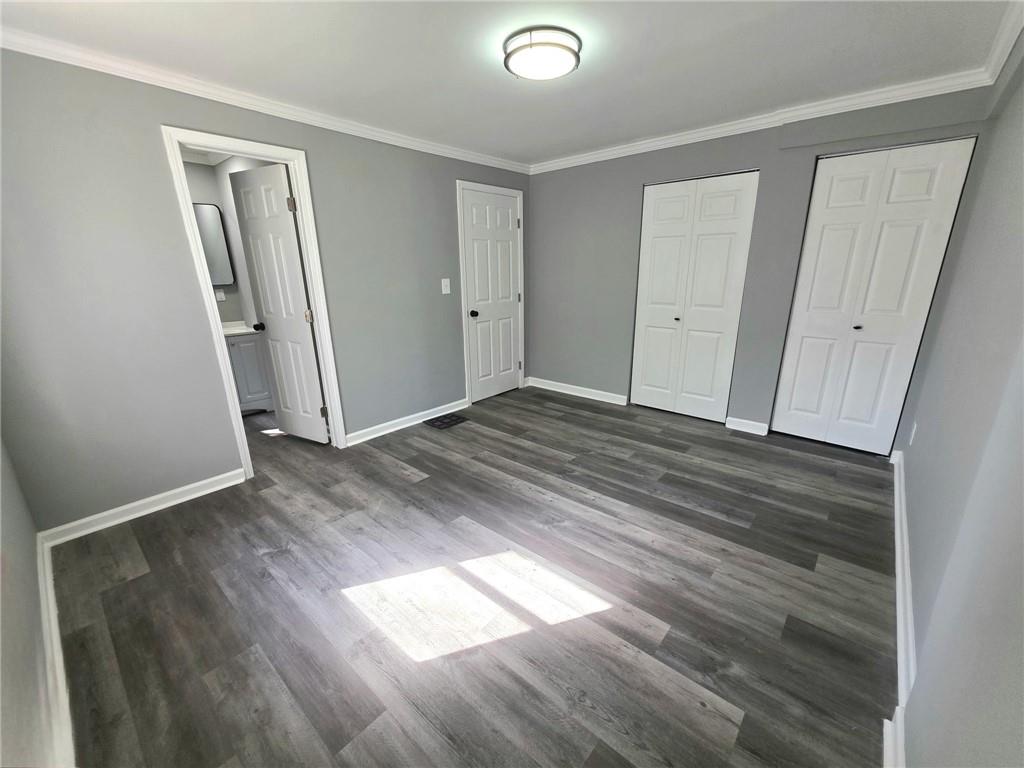 3581 Midway Road Decatur, GA 30032 - Photo 13 of 29 an empty room with wooden floor and closet
