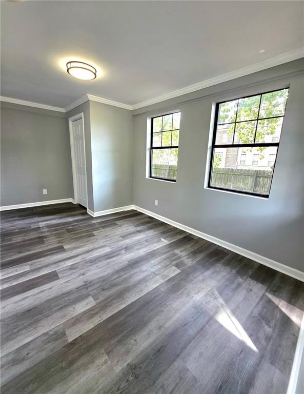 3581 Midway Road Decatur, GA 30032 - Photo 15 of 29 a view of an empty room with wooden floor and a window