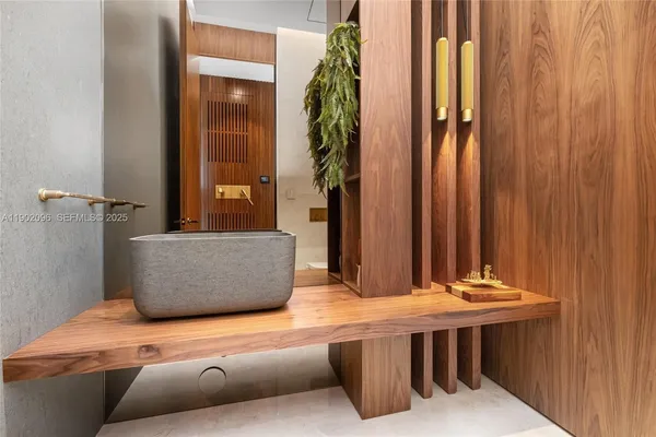 a bathroom with a double vanity sink a mirror and a bathtub