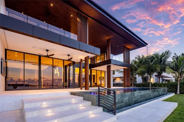 a view of a living room and balcony