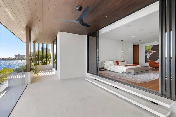 a view of a workspace with a table and chair in a room