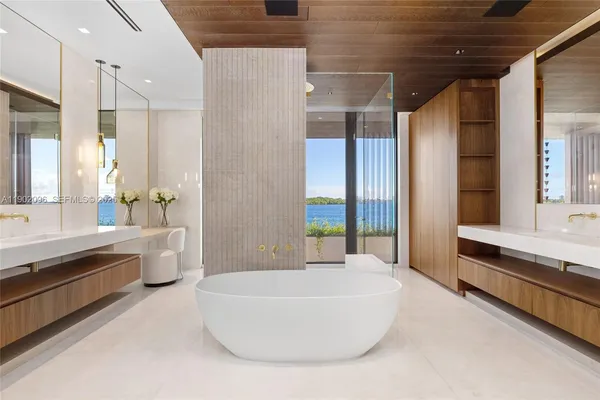 a bathroom with a bathtub and a shower
