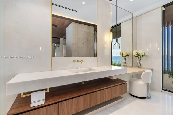 a view of gallery with floor to ceiling window and table