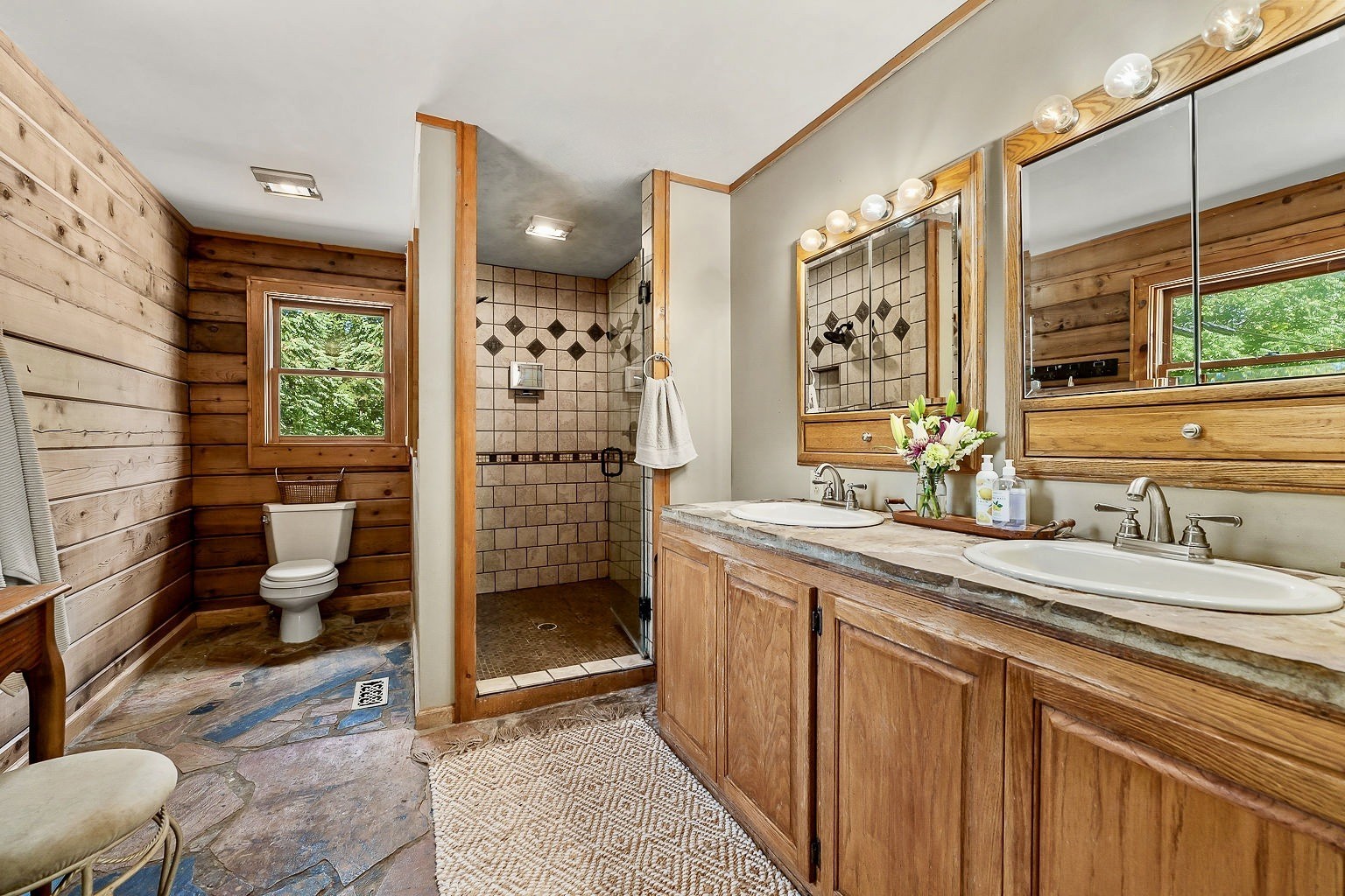 469 Theas Way Liberty, TN 37095 - Photo 20 of 35 a spacious bathroom with a granite countertop sink a toilet a mirror and shower