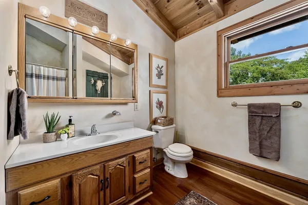 a view of a hallway with windows and stairs