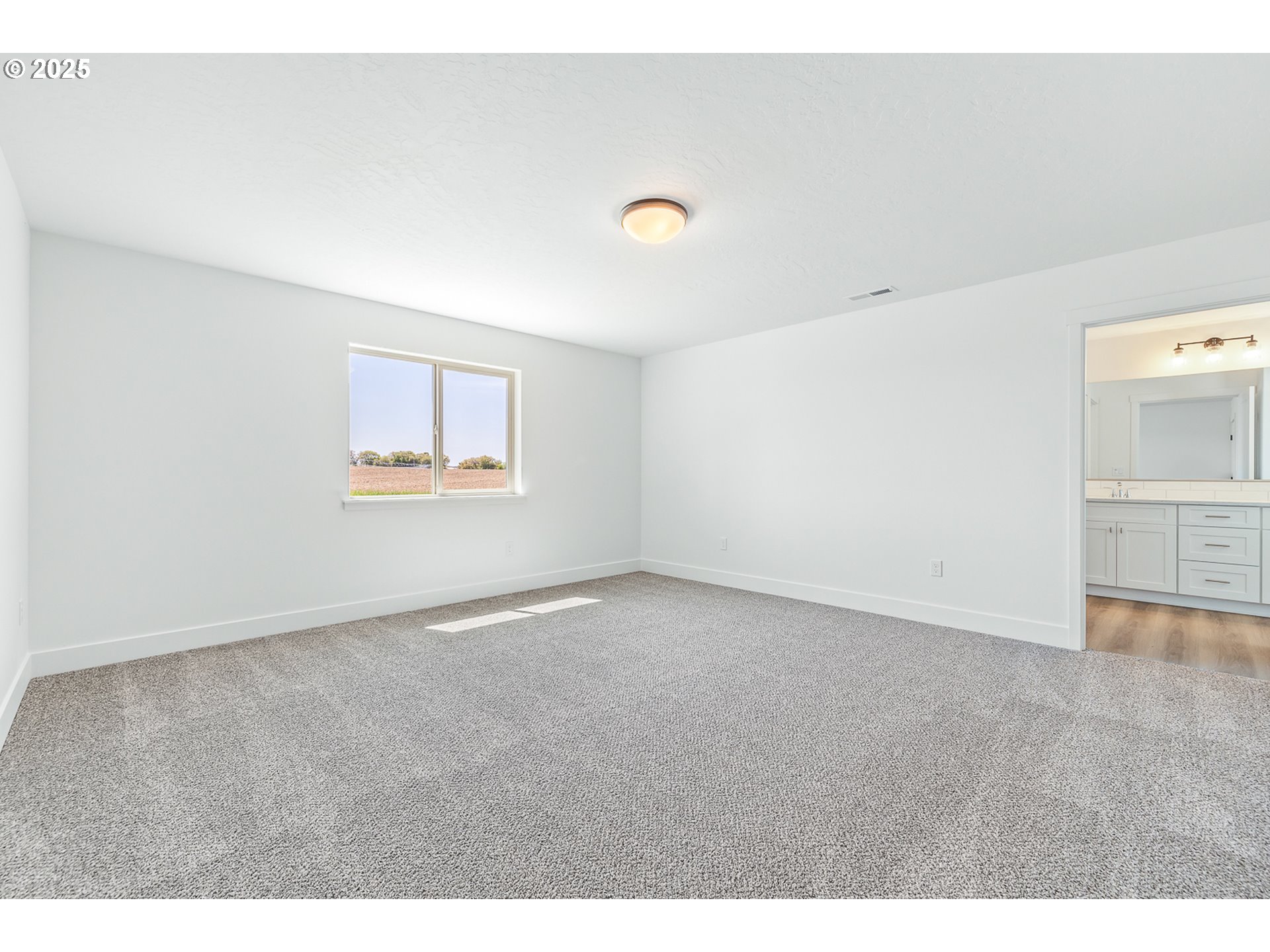 307 Sage Street Boardman, OR 97818 - Photo 4 of 25 a view of an empty room with a window