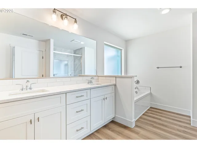 a bathroom with a granite countertop sink mirror and