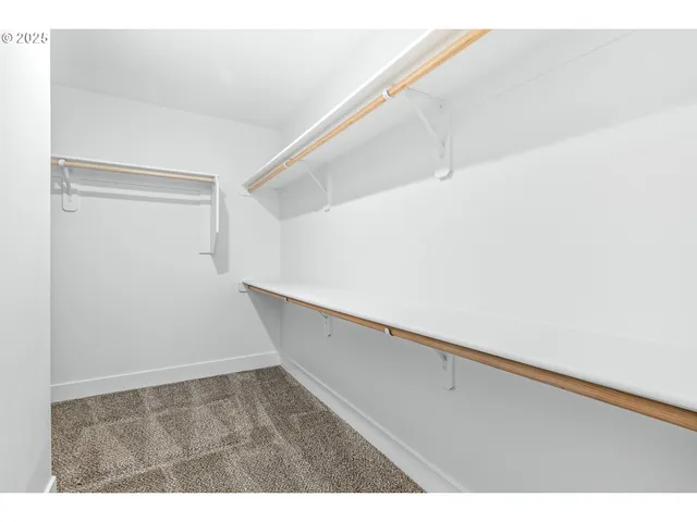 a view of an empty walk in closet