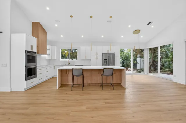 a view of kitchen with furniture and wooden floor