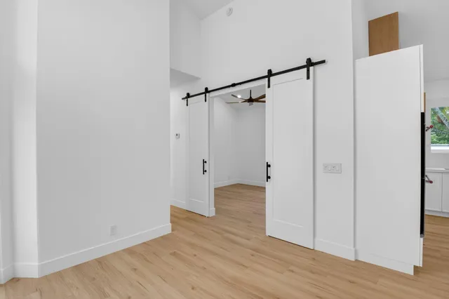 a bathroom with a sink mirror vanity and toilet